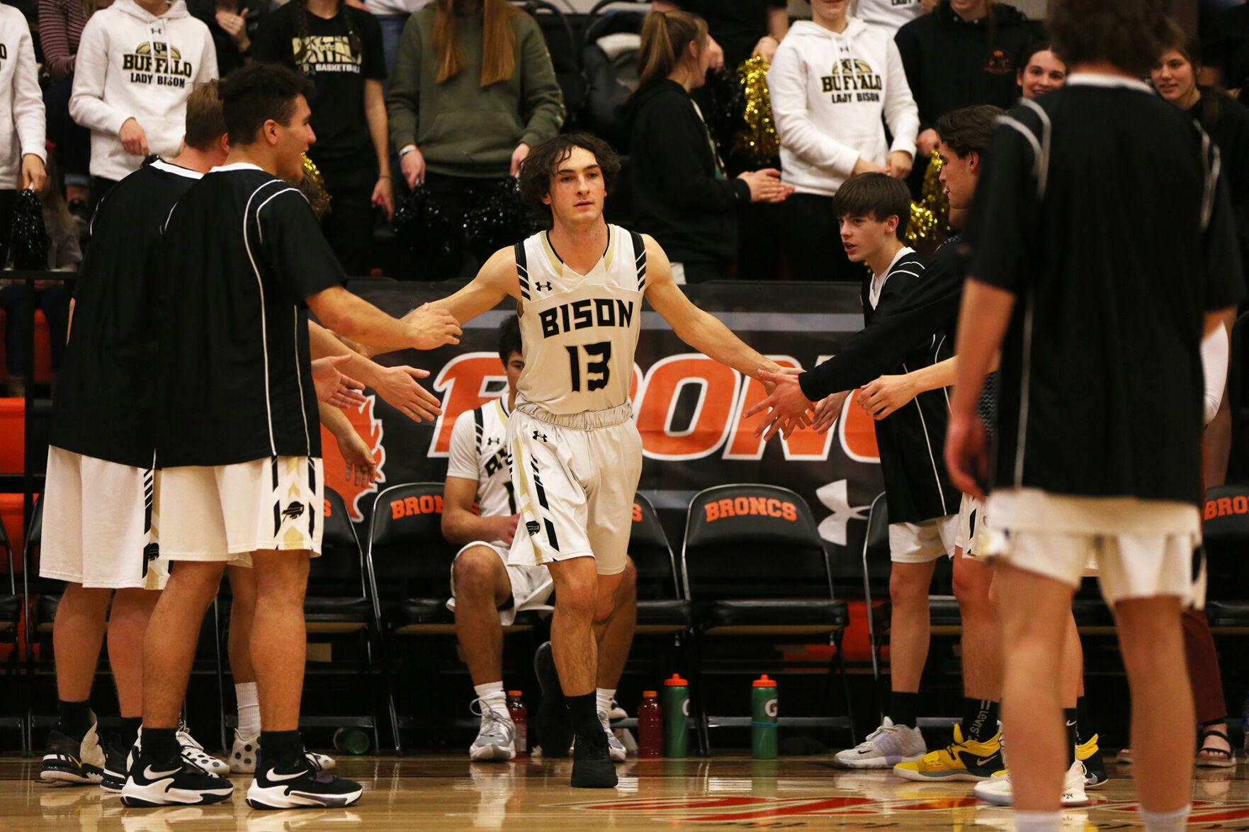 Nate Killian high fives his teammates
